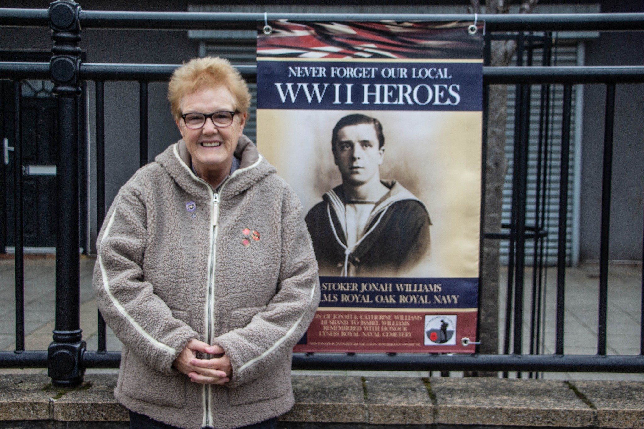 An elderly volunteer at the remembrance garden