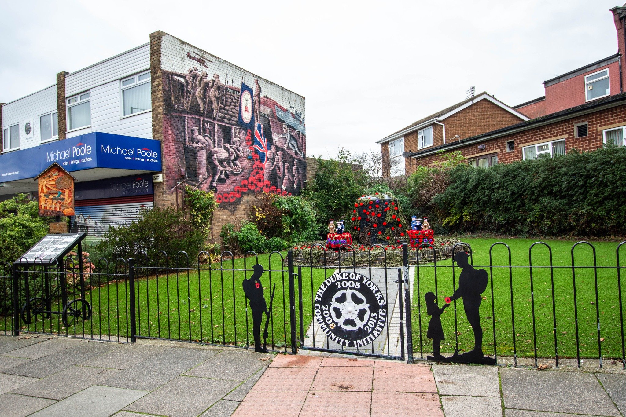 Black metal fence surrounding the Remembrance Garden memorial