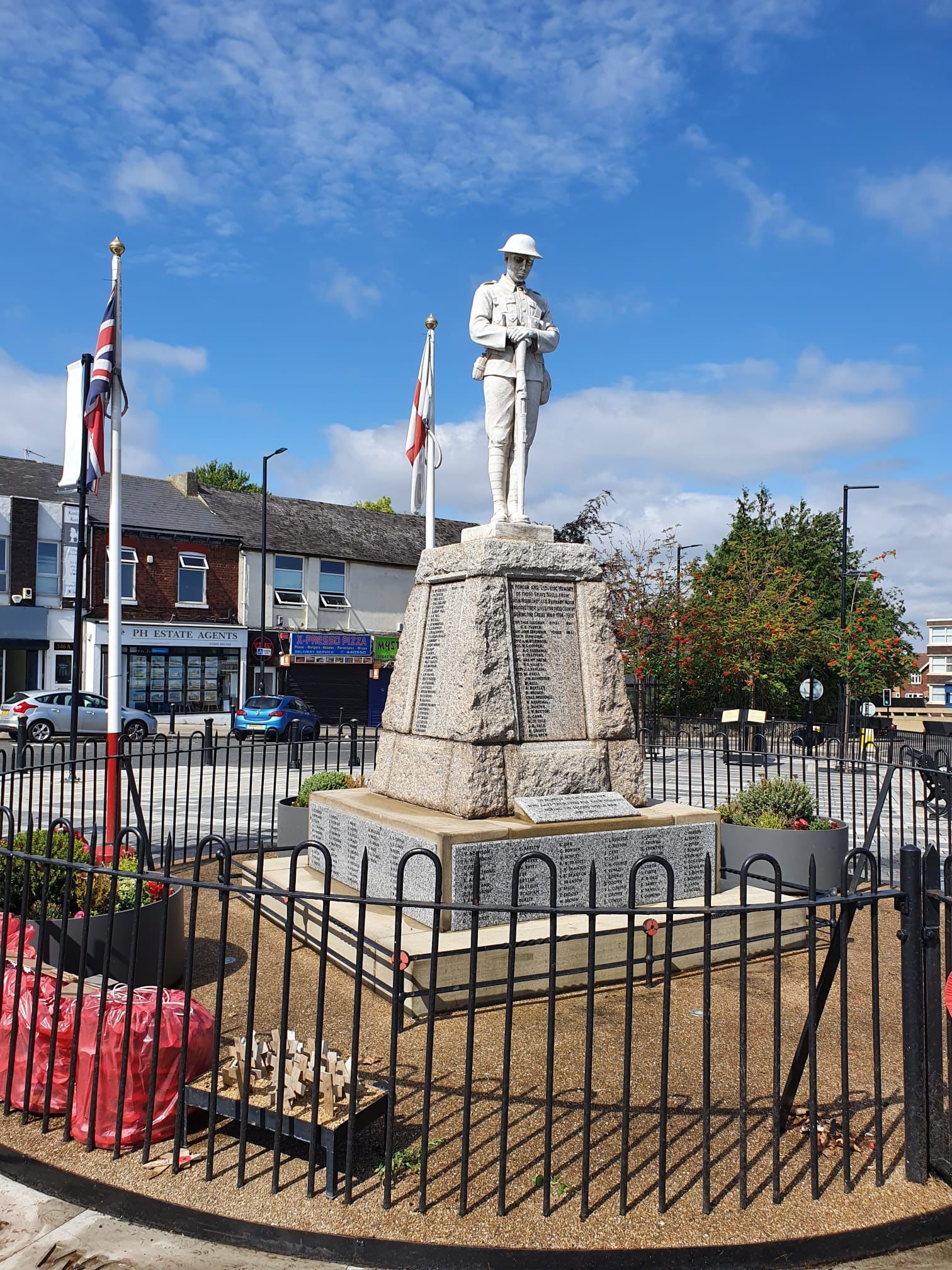 War memorial featuring a soldier statue in uniform